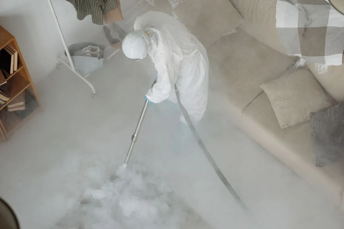 Biohazard cleanup technician in protective equipment, Ashaway, RI